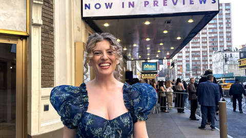 Goldie stands in front of The Notebook, Broadway marquee in New York City