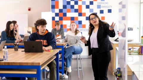Students listen while Professor Gulay Guzel leads a MIDE 201 class.
