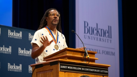 Colson Whitehead stands at a podium and delivers a speech as the 14th Janet Weis Fellow in Contemporary Letters.