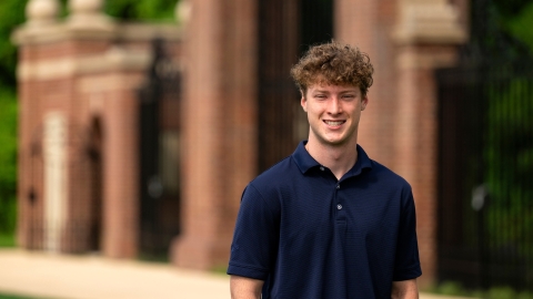 Max Wilson ’27 smiles while standing outside.