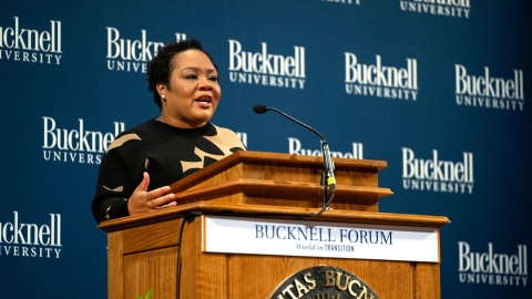 Yamiche Alcindor speaks at a podium during the Bucknell Forum.