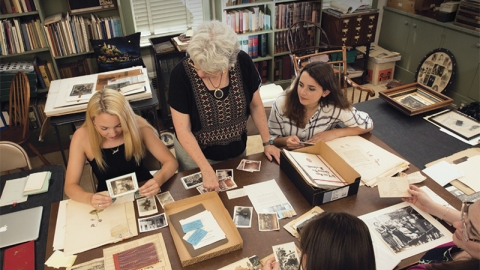 Interns sort through photos