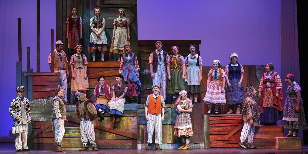 Students on stage during a performance of Brundibar