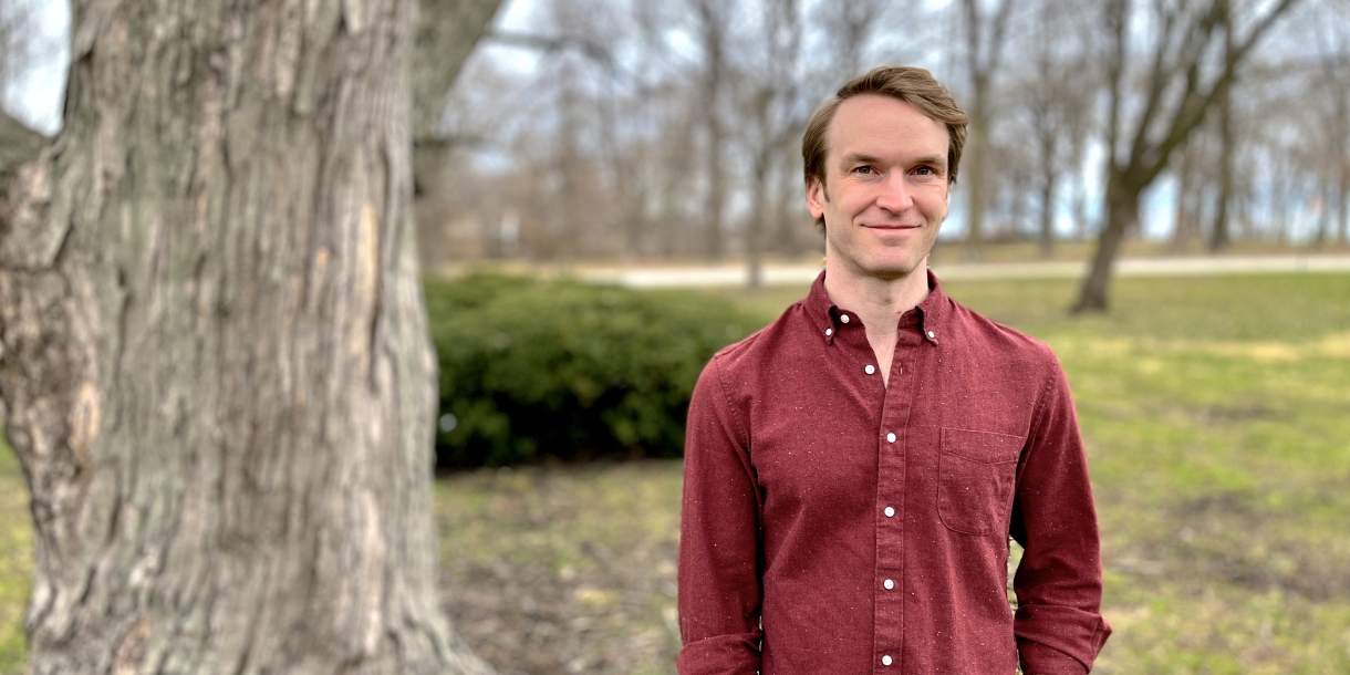 Portrait of Matt Kandler outside near a tree.