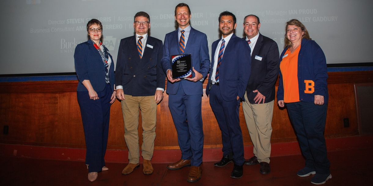 Members of the Bucknell SBDC staff with their award