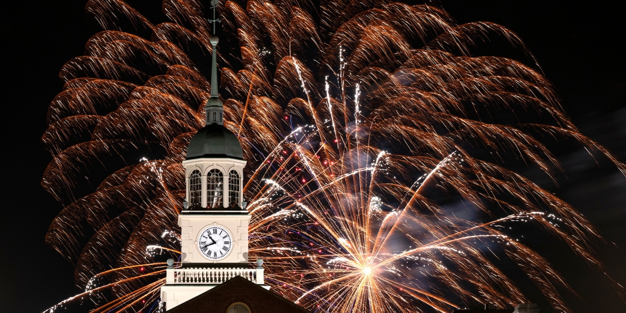 Fireworks explode over the clock tower at Bertrand Library during the night. 