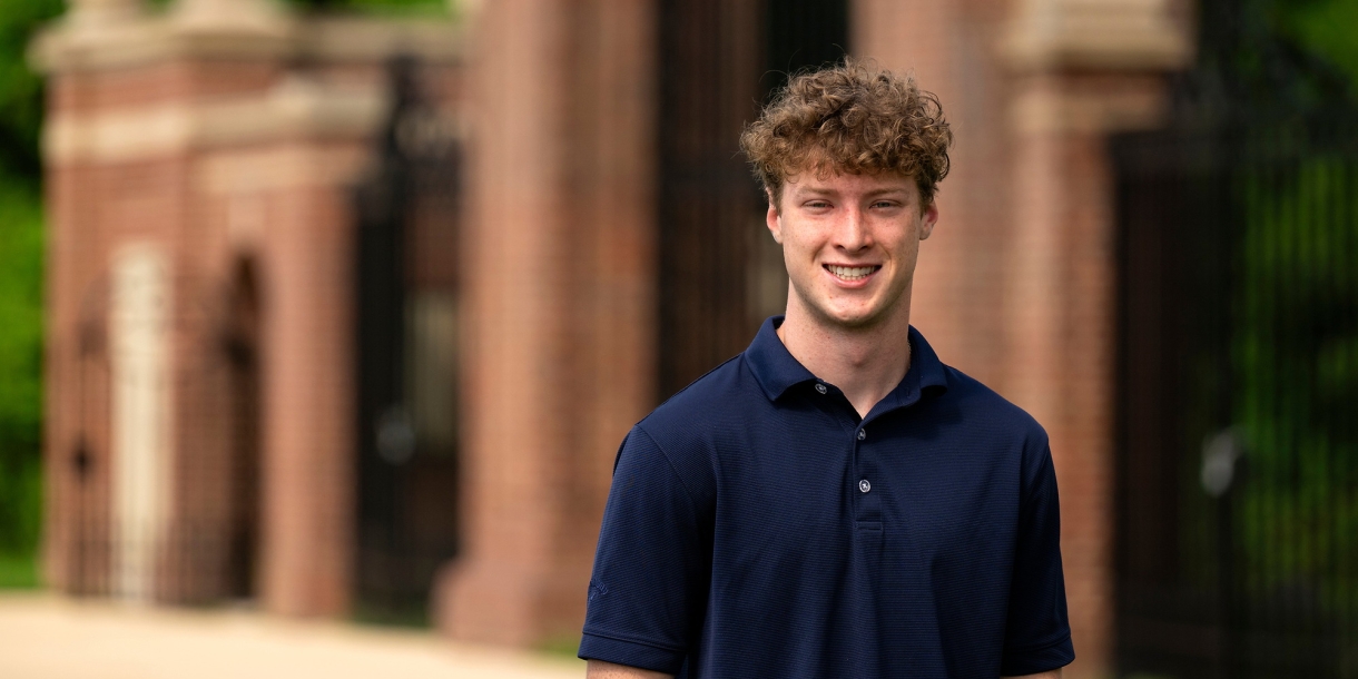 Max Wilson ’27 smiles while standing outside.