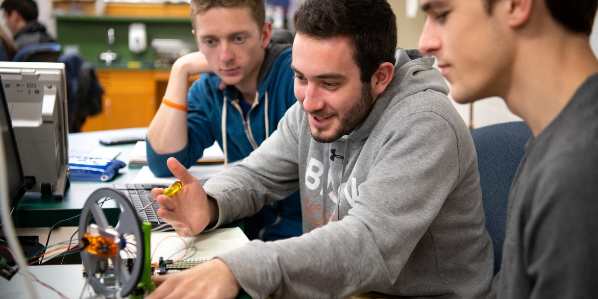 Students in mechanical engineering classroom.