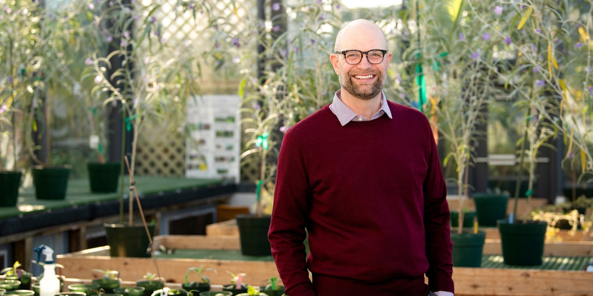 Portrait of Chris Martine inside of the Rooke Science greenhouse