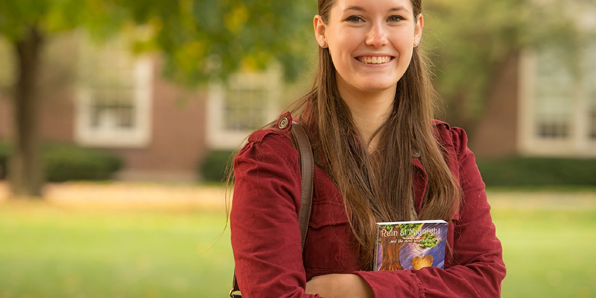 Woman standing with her book