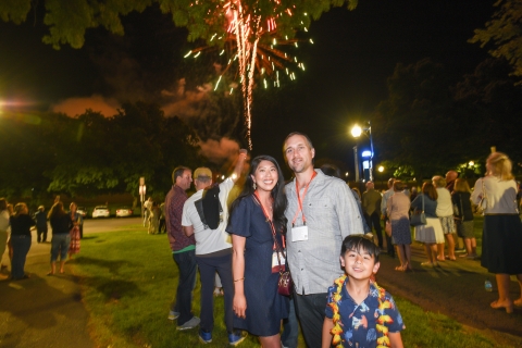 A Bucknell family poses under the fireworks.