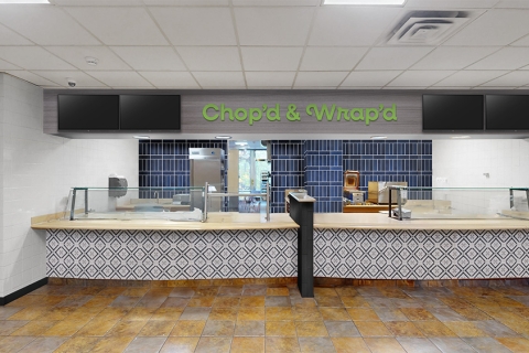 An eatery counter with the sign Chop&#039;d &amp; Wrap&#039;d in the Bison Cafe.