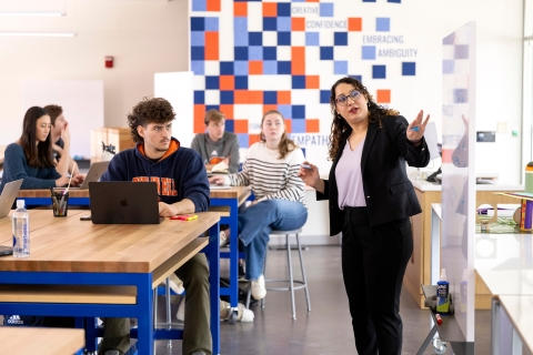 Students listen while Professor Gulay Guzel leads a MIDE 201 class.