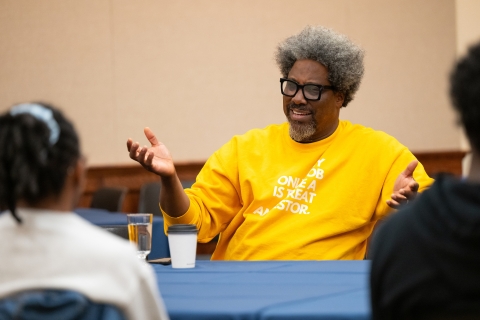 W. Kamau Bell speaks with a group of Bucknell students.