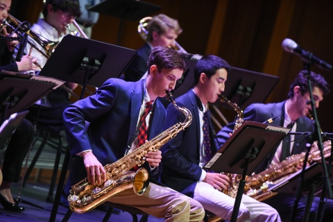 Student playing a saxophone in the Jazz Band