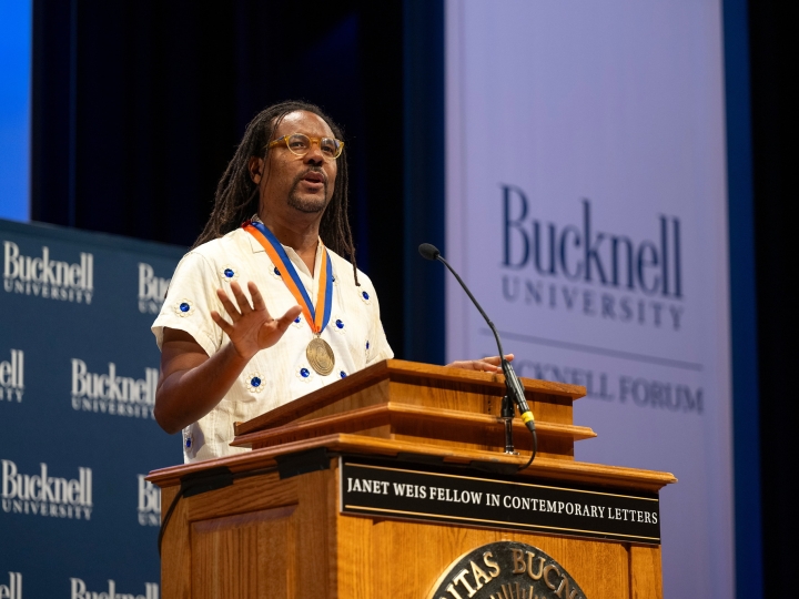 Colson Whitehead stands at a podium and delivers a speech as the 14th Janet Weis Fellow in Contemporary Letters.