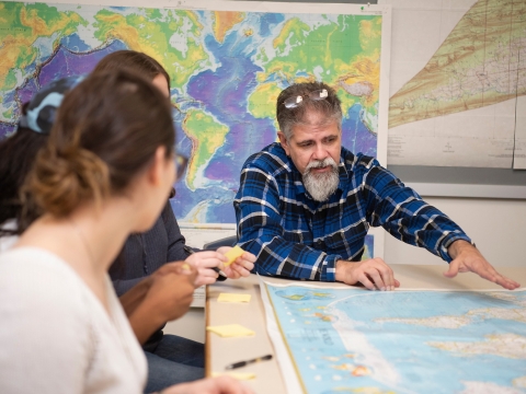 Faculty and students in geography class