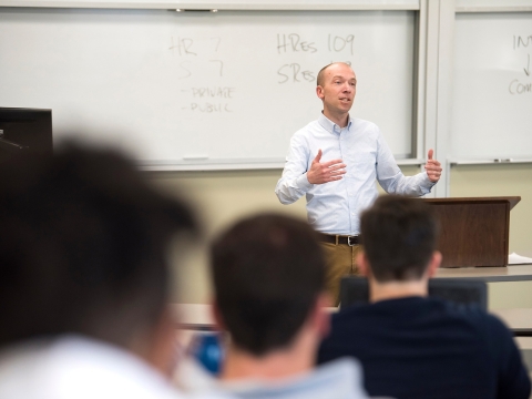 Professor teaching in front of a class