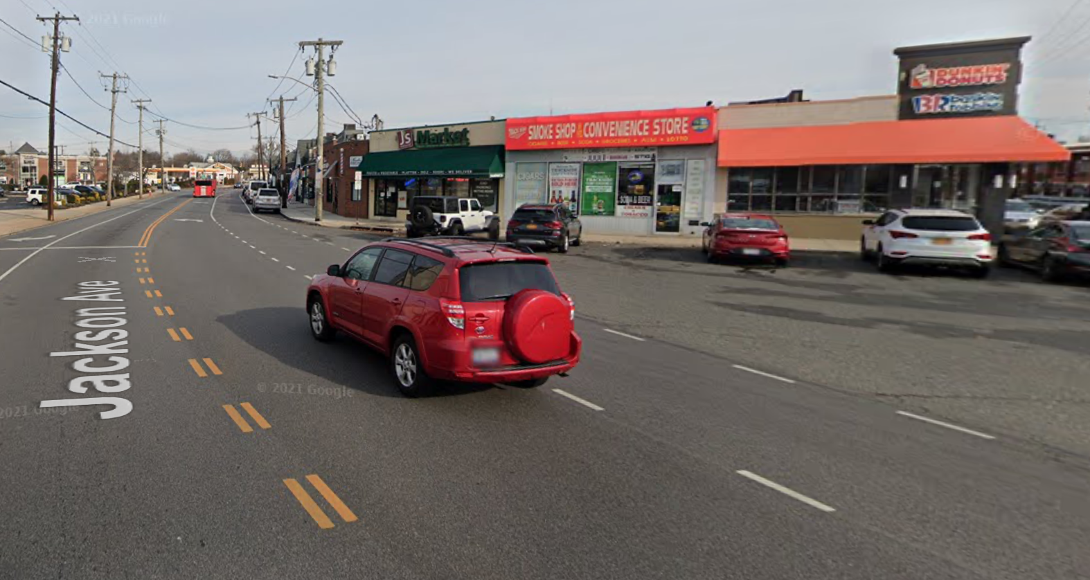 Syosset LIRR shuttle stop location. after Dunkin' Donuts on the right of Jackson Avenue