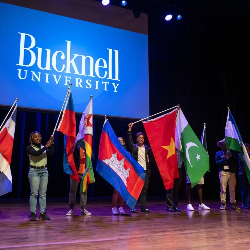 GC3: Global Connections, Cultures & Community students holding flags